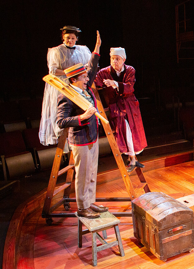 Jacque Wilke as Ghost of Christmas Past, Dan Rosales as Young Scrooge, and Robert Joy as Ebenezer Scrooge. Ebenezer Scrooge's BIG San Diego Christmas Show runs November 23 – December 29, 2019 at The Old Globe. Photo by Jim Cox.